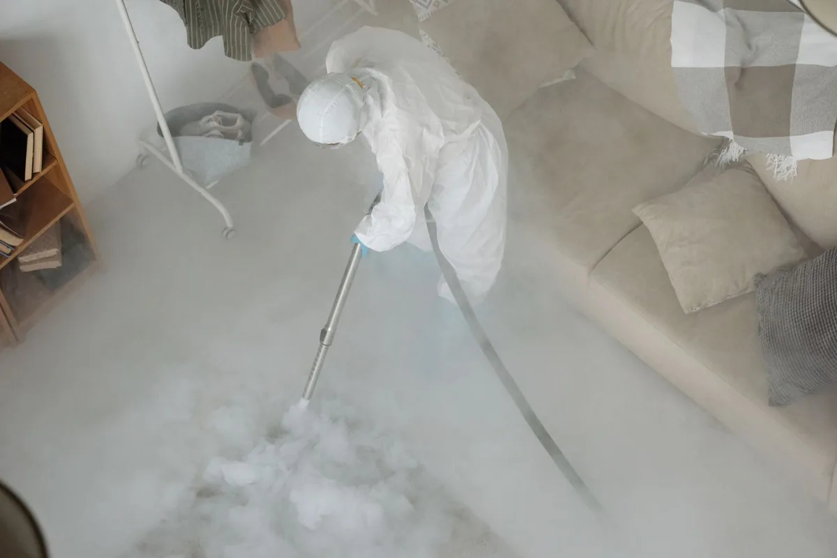 Biohazard cleanup technician in protective equipment, Alamitos Heights, Long Beach, CA